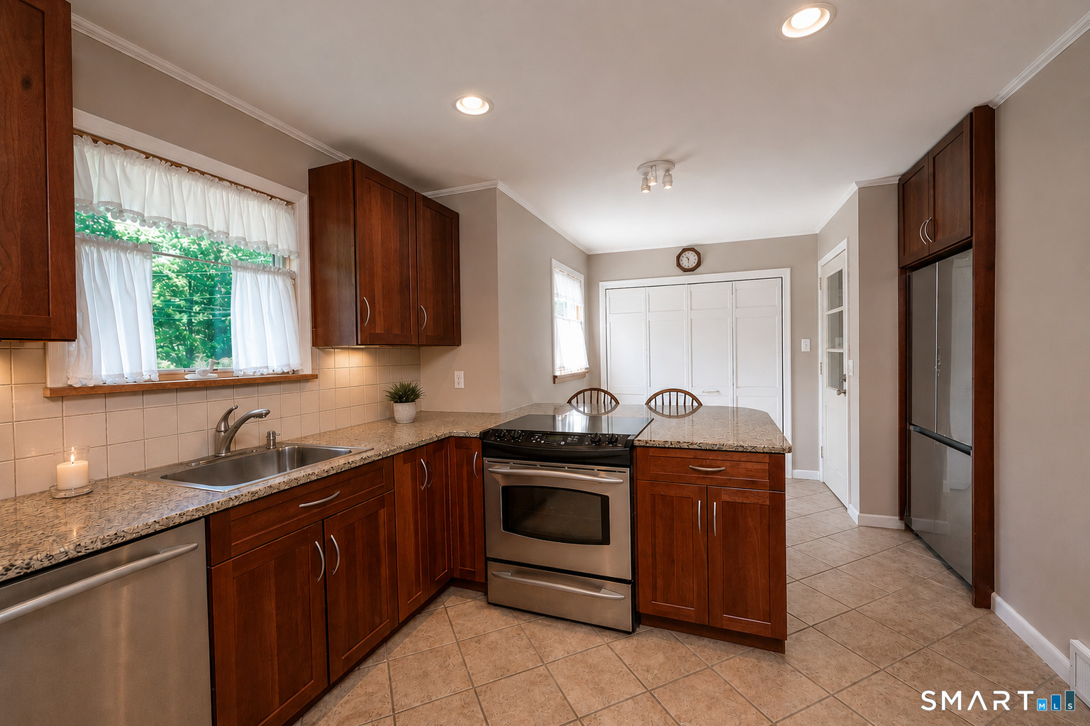 39 Indian Mountain Road Salisbury, CT 06039 - Photo 4 of 16 a kitchen with stainless steel appliances granite countertop a sink stove and refrigerator