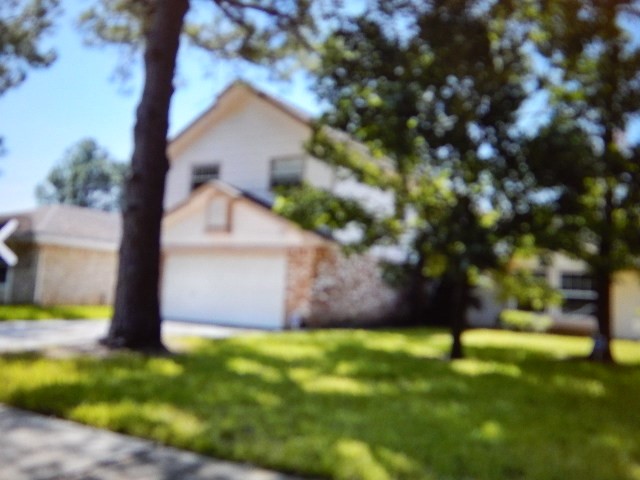 7715 Goldengrove Drive Spring, TX 77379 - Photo 2 of 6 a view of a tree with a yard