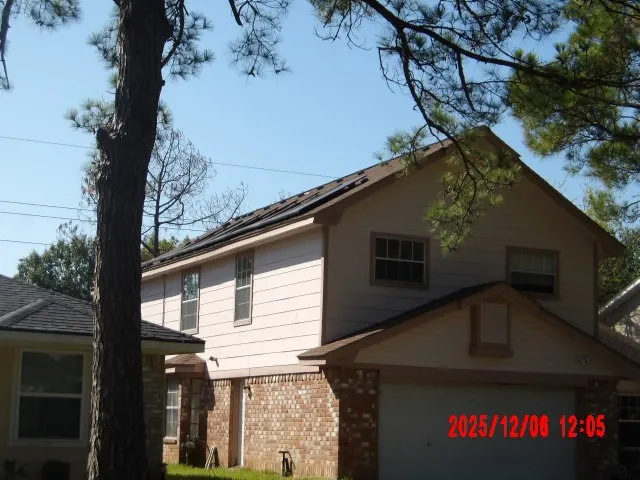 a view of a house with a tree