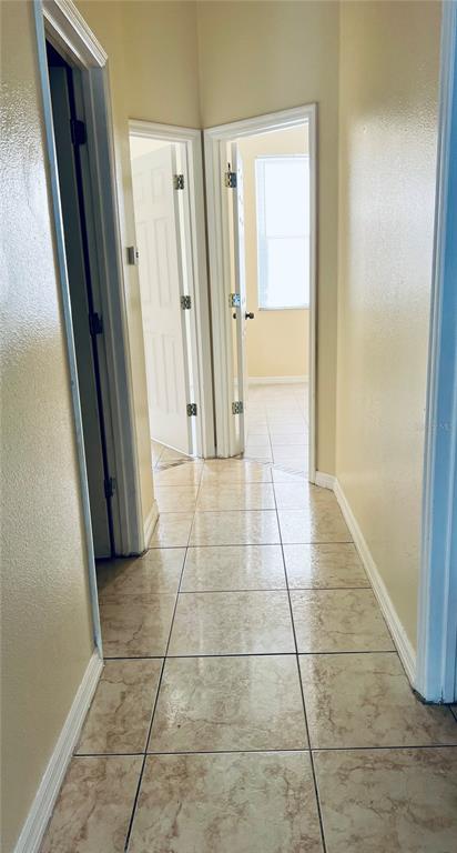 13367 Luxbury Loop Orlando, FL 32837 - Photo 19 of 49 a bathroom with a glass door shower and a mirror