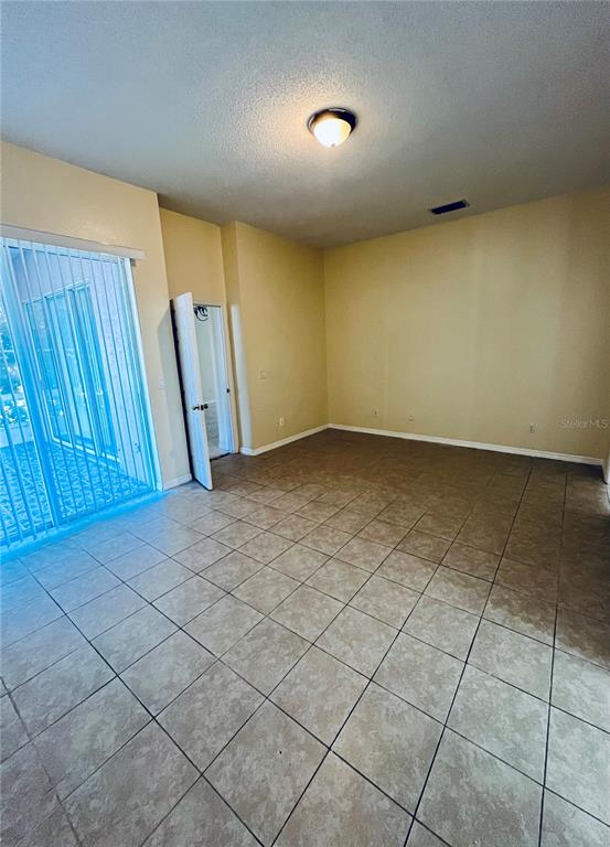 13367 Luxbury Loop Orlando, FL 32837 - Photo 30 of 49 an empty room with a window