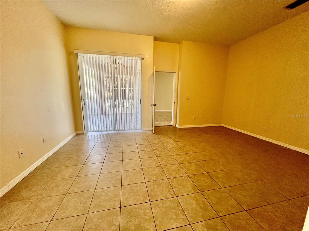 13367 Luxbury Loop Orlando, FL 32837 - Photo 31 of 49 a view of an empty room with a window