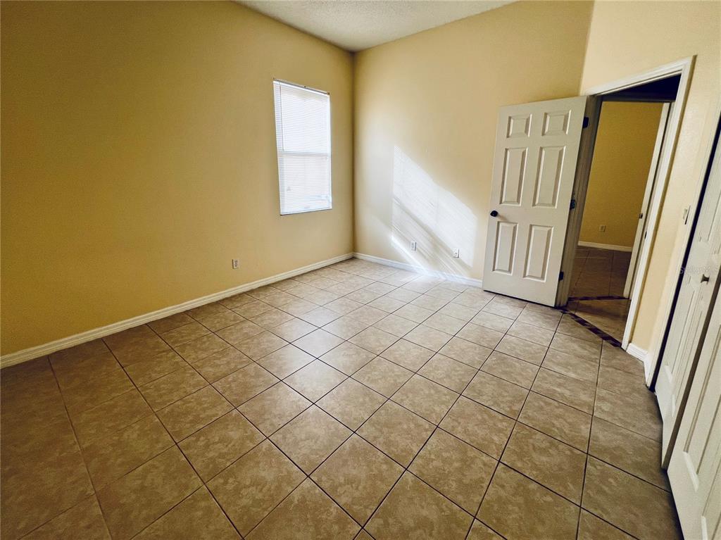 13367 Luxbury Loop Orlando, FL 32837 - Photo 38 of 49 a view of an empty room and staircase