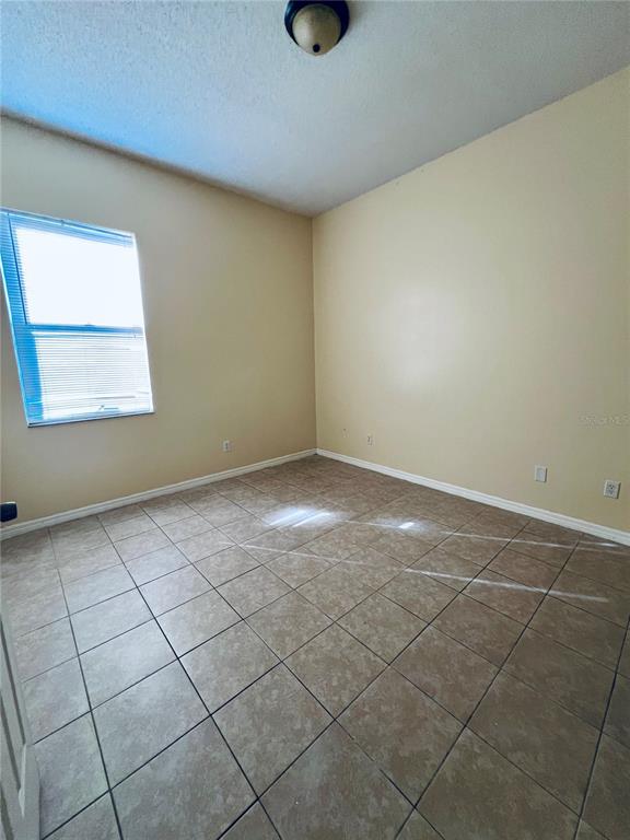 13367 Luxbury Loop Orlando, FL 32837 - Photo 39 of 49 a view of an empty room and window