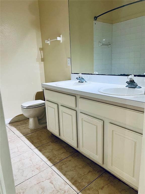 13367 Luxbury Loop Orlando, FL 32837 - Photo 41 of 49 a bathroom with a sink and a mirror