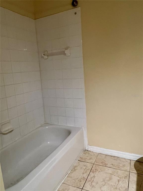 13367 Luxbury Loop Orlando, FL 32837 - Photo 43 of 49 a bathroom with a bathtub