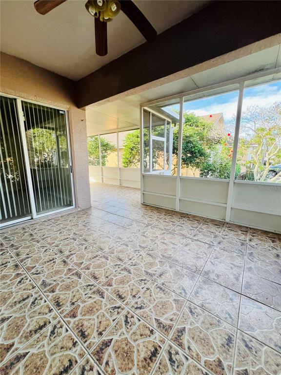 13367 Luxbury Loop Orlando, FL 32837 - Photo 47 of 49 a view of empty room with floor to ceiling window and wooden floor