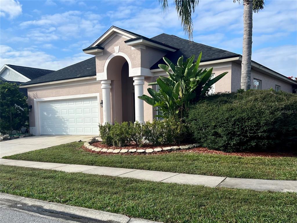 13367 Luxbury Loop Orlando, FL 32837 - Photo 5 of 49 a front view of a house with a yard