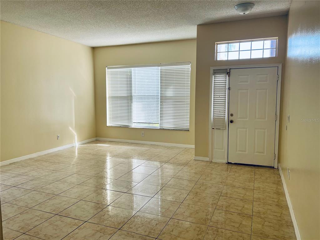 13367 Luxbury Loop Orlando, FL 32837 - Photo 8 of 49 an empty room with windows and closet