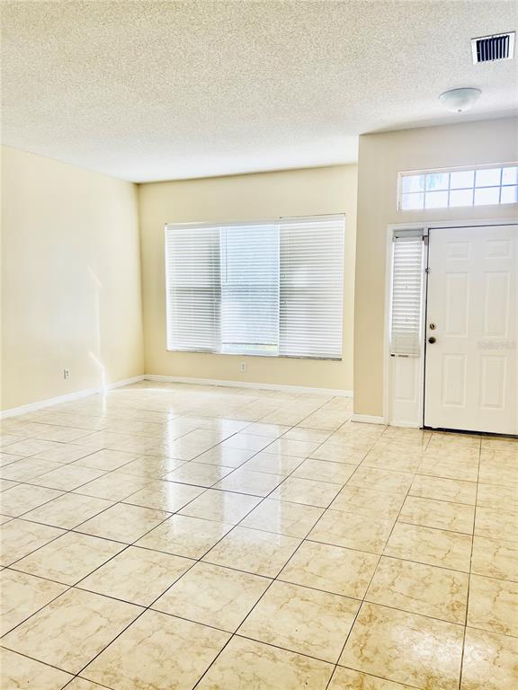 13367 Luxbury Loop Orlando, FL 32837 - Photo 10 of 49 a view of an empty room with a window