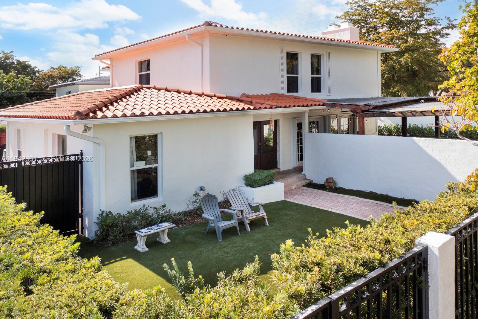 a front view of house with yard outdoor seating and entertaining space