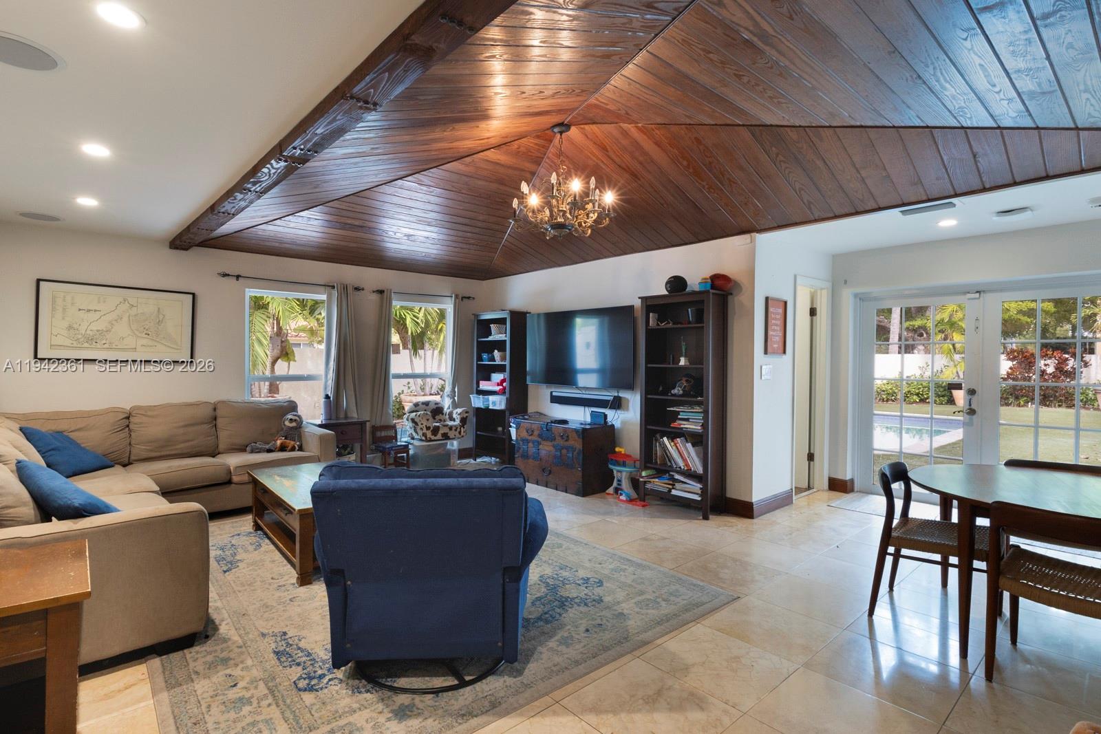 360 Southwest 28th Road Miami, FL 33129 - Photo 12 of 31 a living room with furniture and a flat screen tv