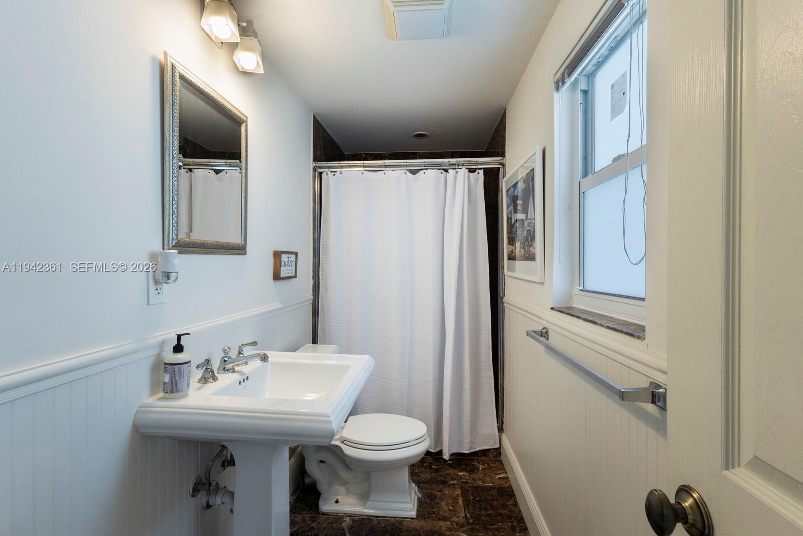 360 Southwest 28th Road Miami, FL 33129 - Photo 16 of 41 a bathroom with a sink toilet and shower
