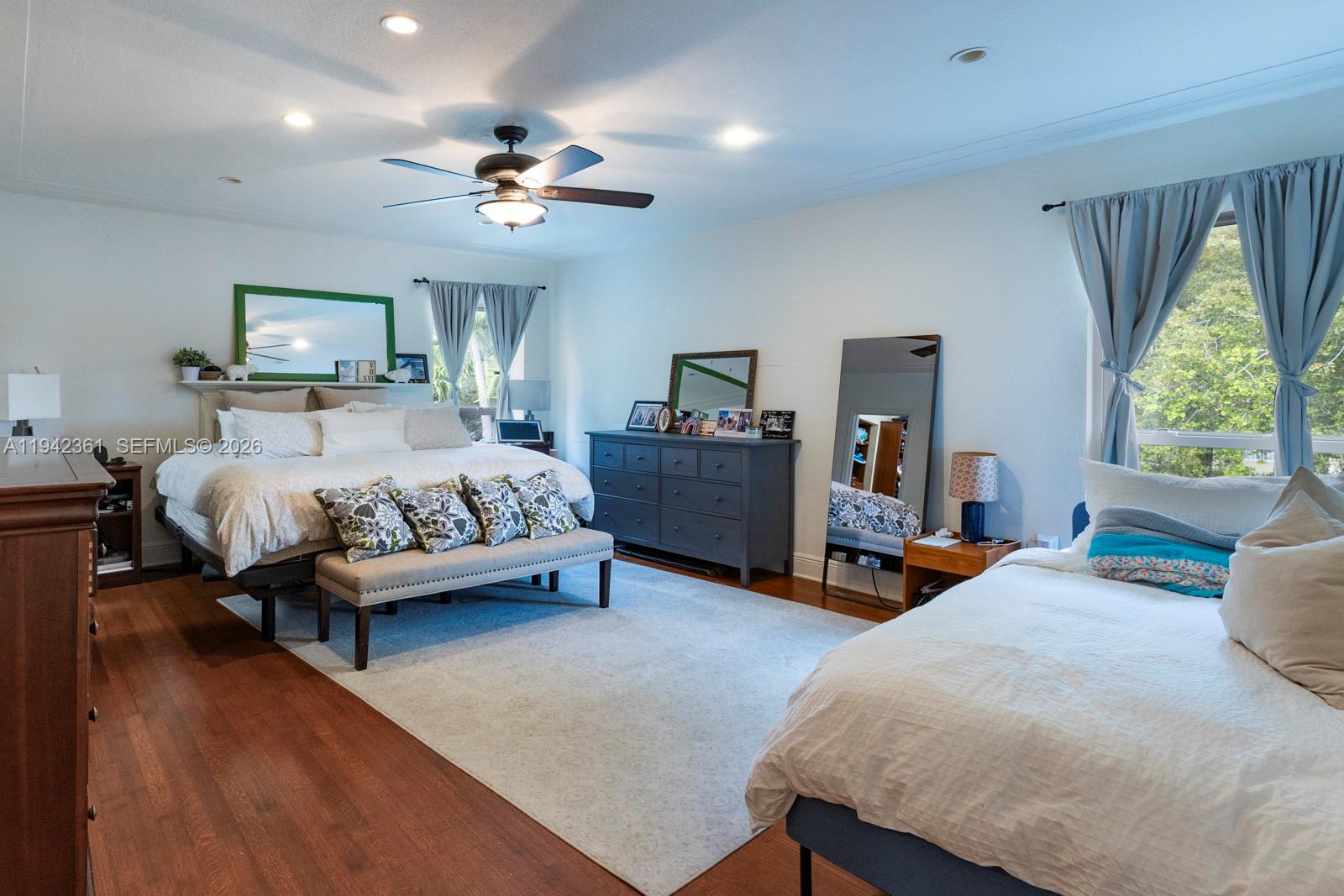 360 Southwest 28th Road Miami, FL 33129 - Photo 17 of 31 a bedroom with bed and a chandelier