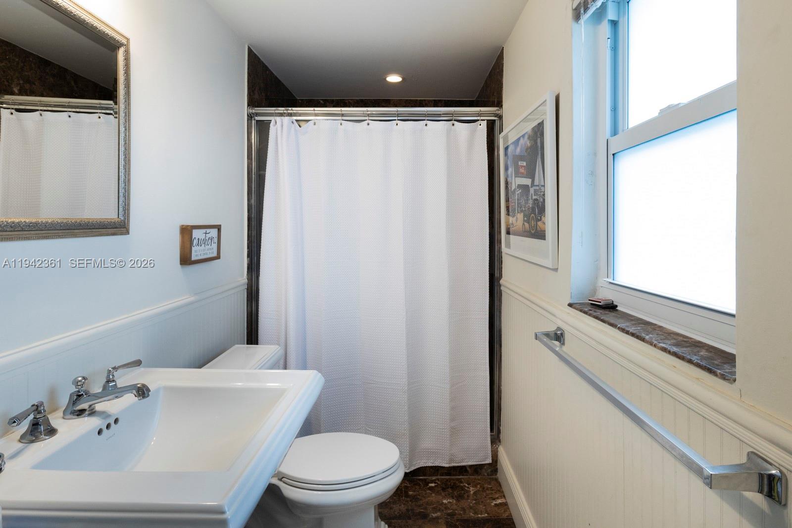 360 Southwest 28th Road Miami, FL 33129 - Photo 18 of 36 Downstairs Family Room and Pool Bathroom