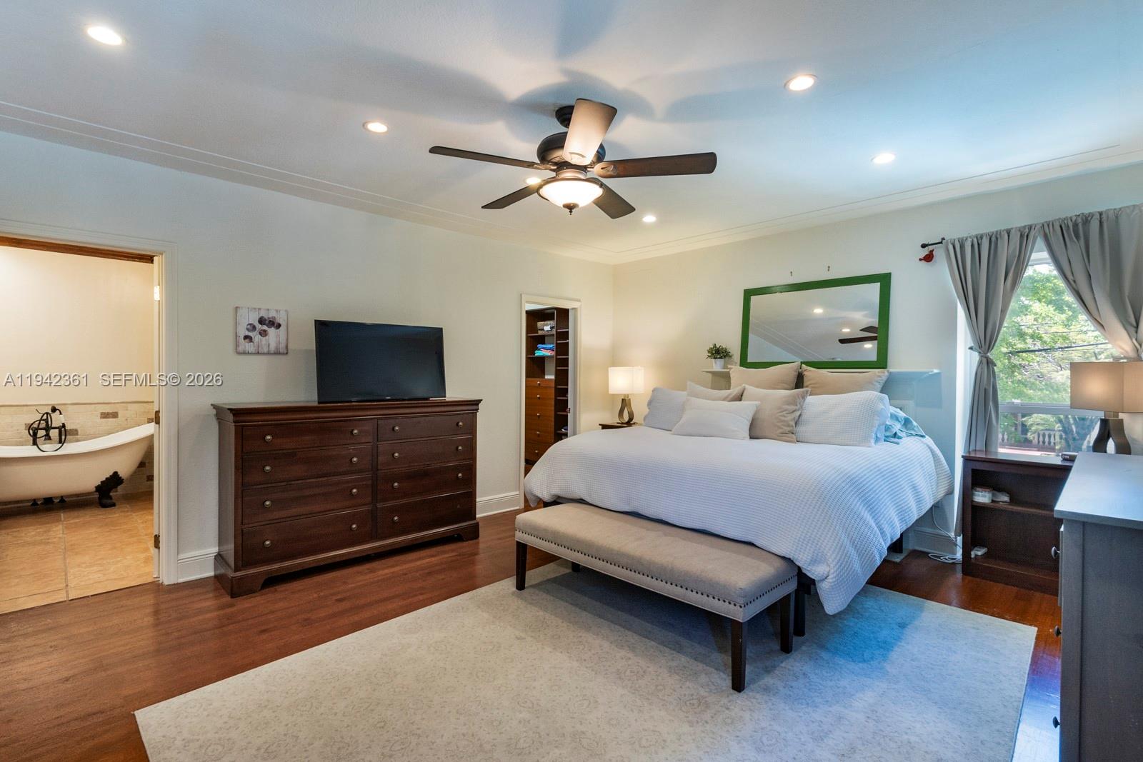 360 Southwest 28th Road Miami, FL 33129 - Photo 22 of 41 a bedroom with a bed and wooden floor