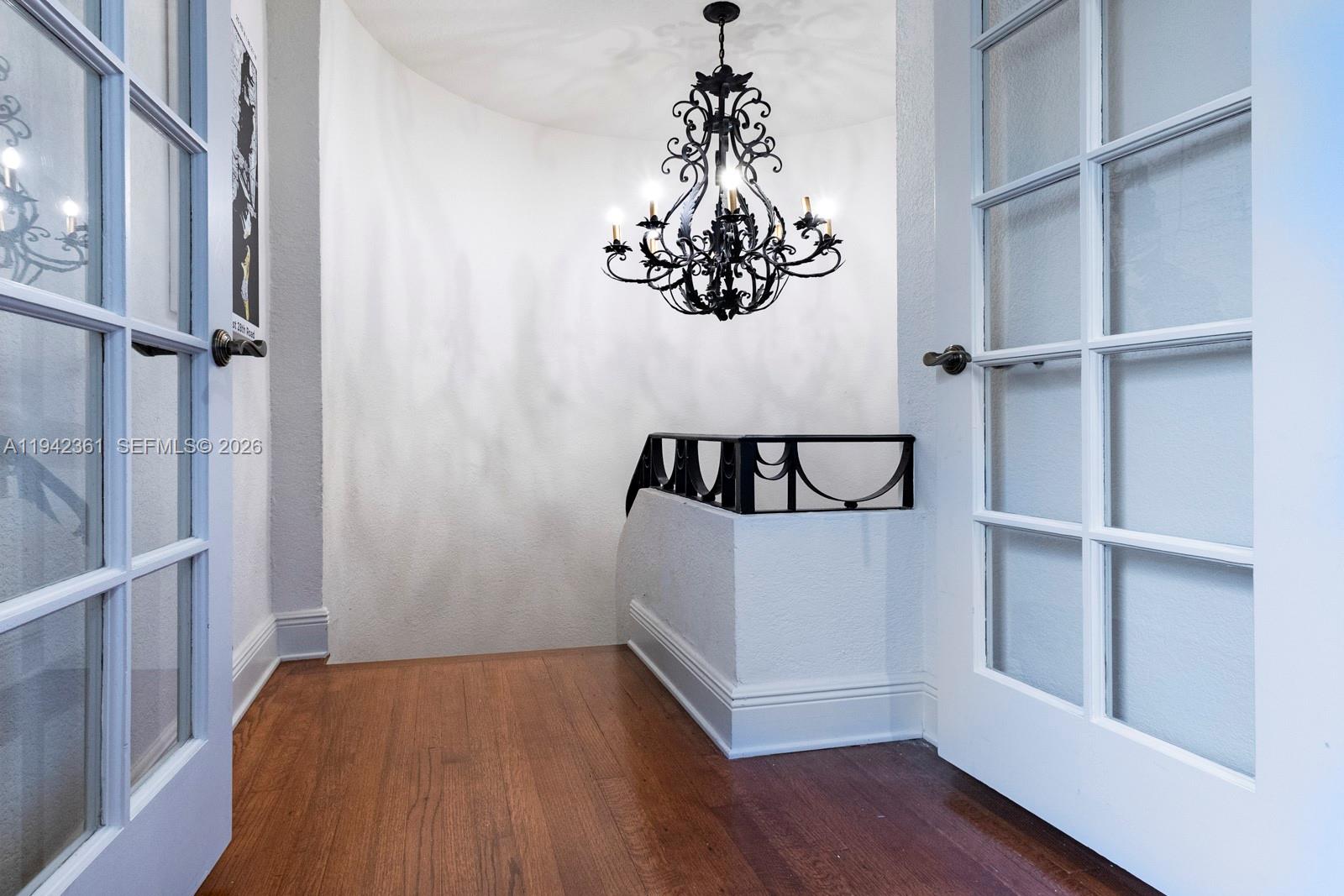 360 Southwest 28th Road Miami, FL 33129 - Photo 22 of 36 Top of Primary Staircase with Chandelier