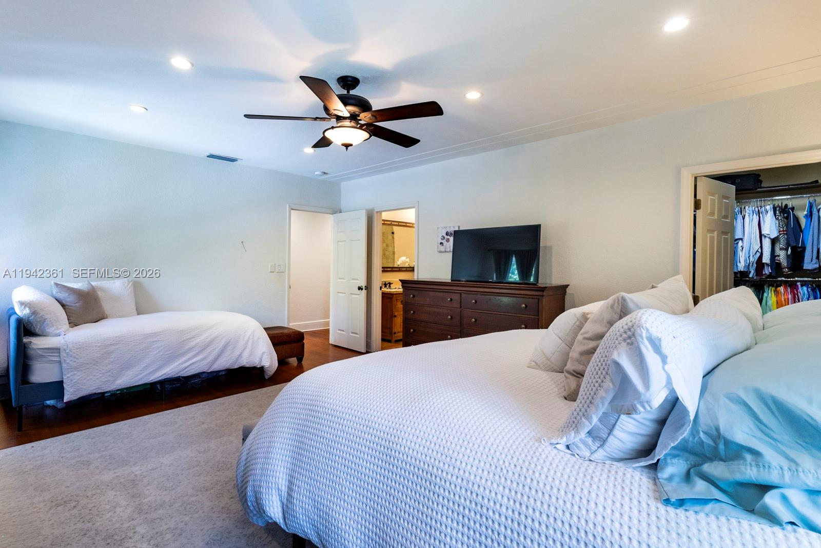 360 Southwest 28th Road Miami, FL 33129 - Photo 23 of 41 a bedroom with two beds and a chandelier
