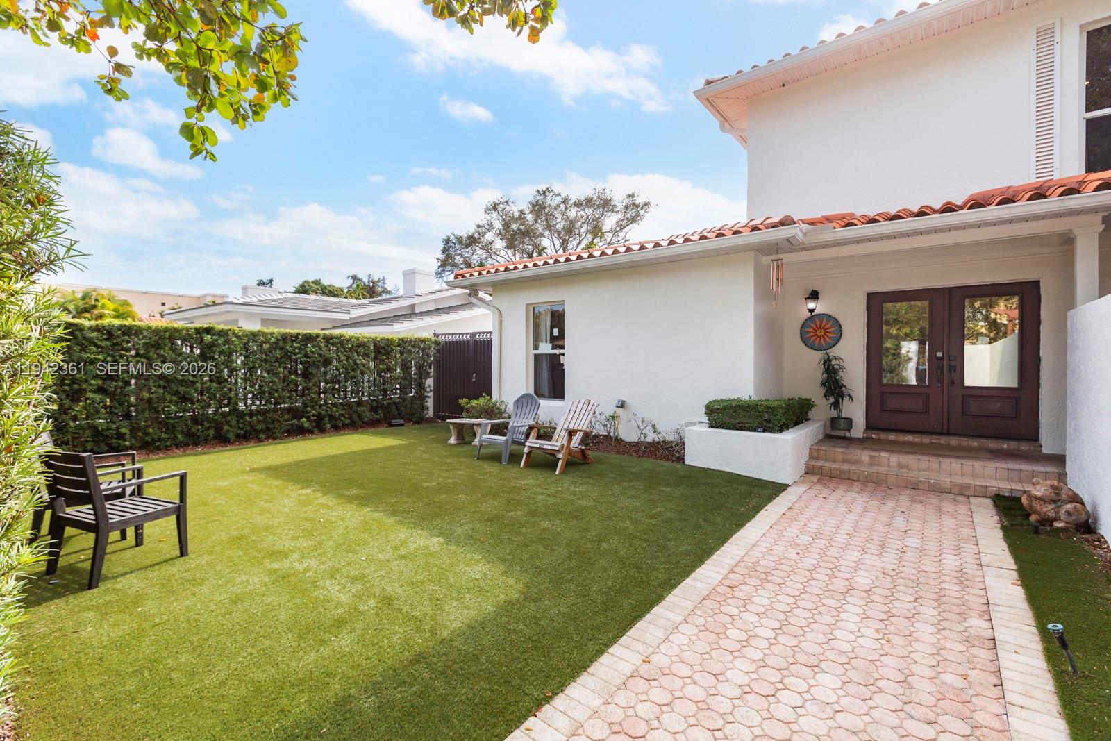 360 Southwest 28th Road Miami, FL 33129 - Photo 24 of 31 a view of a house with swimming pool and a yard