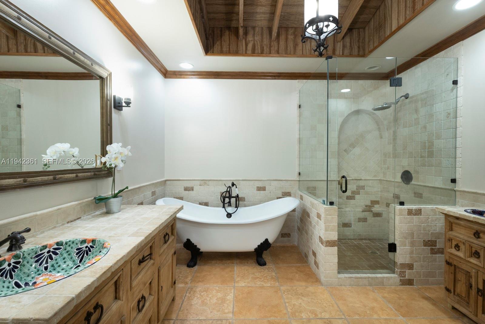360 Southwest 28th Road Miami, FL 33129 - Photo 24 of 41 a spacious bathroom with a tub sink and mirror