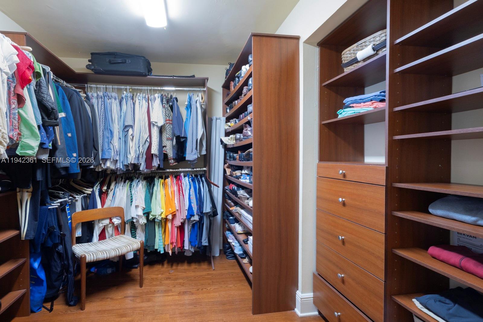360 Southwest 28th Road Miami, FL 33129 - Photo 25 of 41 a view of walk in closet with clothes and shoes