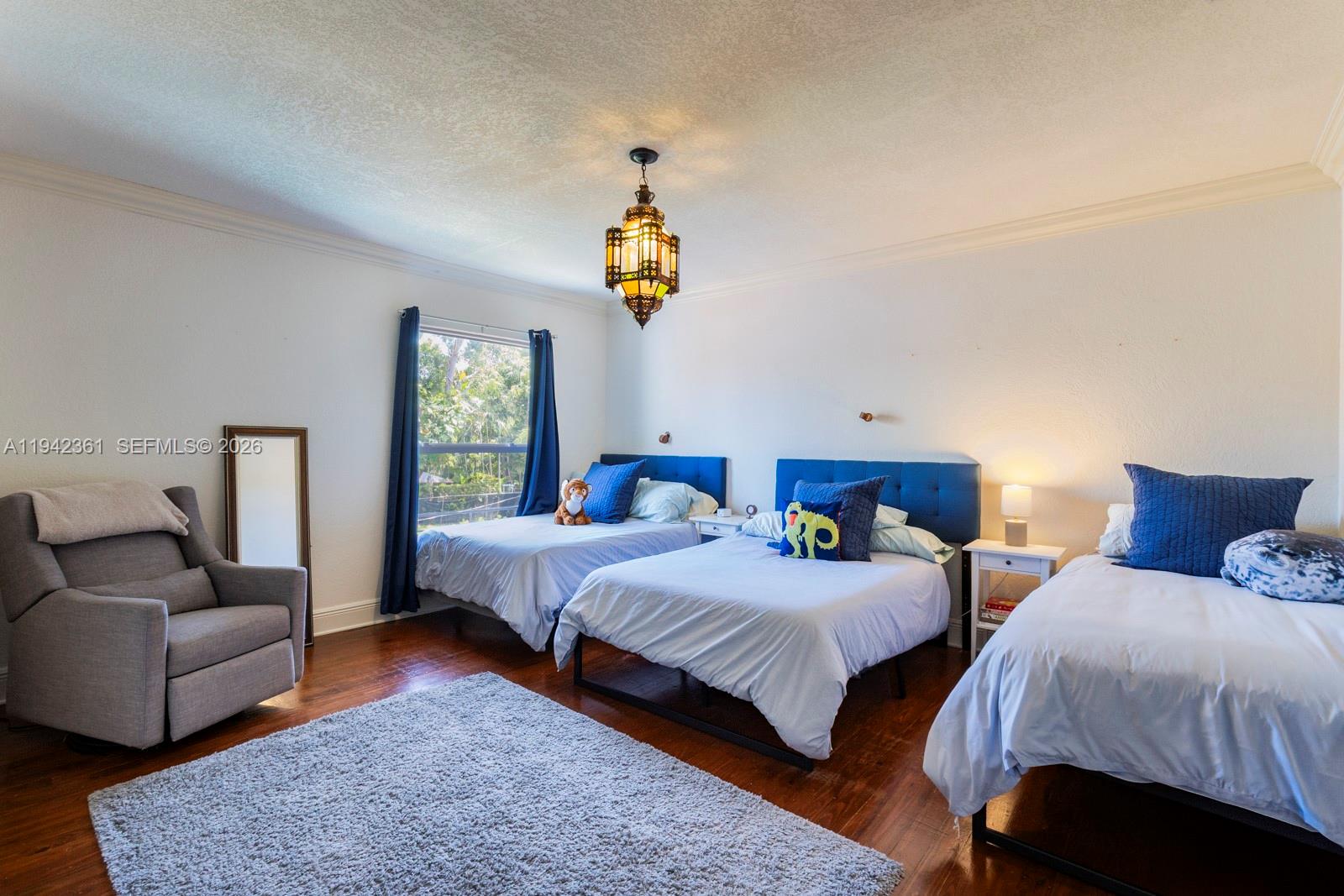 360 Southwest 28th Road Miami, FL 33129 - Photo 27 of 41 a bedroom with two beds and a couch