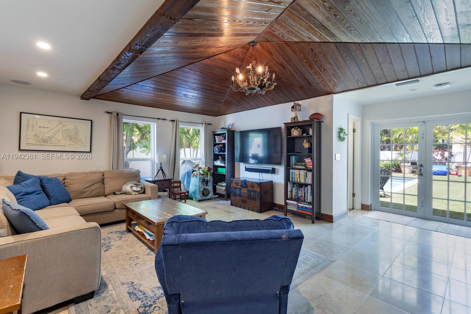 360 Southwest 28th Road Miami, FL 33129 - Photo 3 of 41 a living room with furniture and a flat screen tv