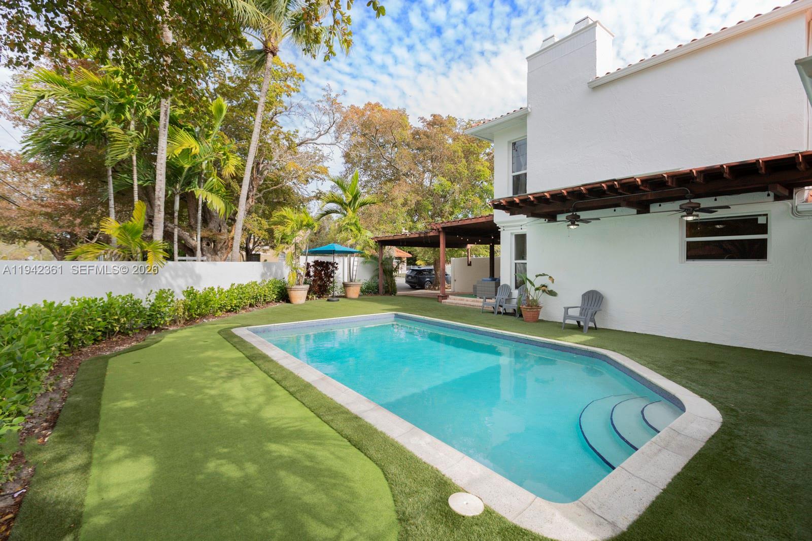 360 Southwest 28th Road Miami, FL 33129 - Photo 5 of 31 a view of a pool with a patio