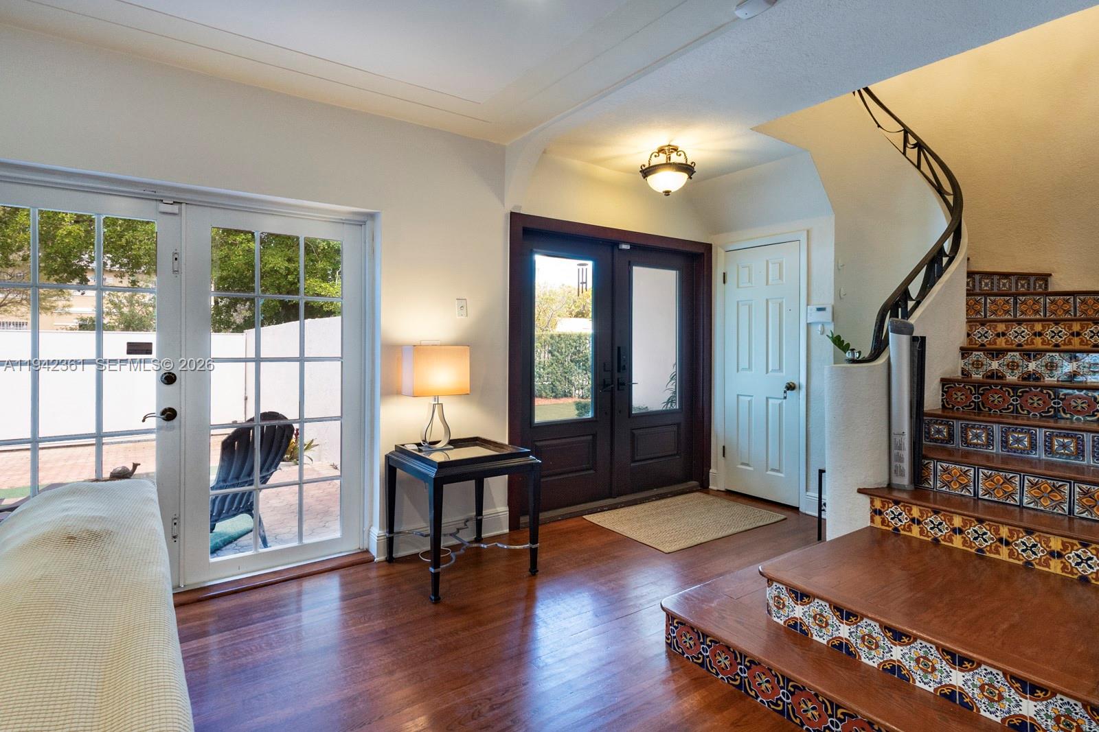 360 Southwest 28th Road Miami, FL 33129 - Photo 6 of 41 a living room with furniture lamp and large windows