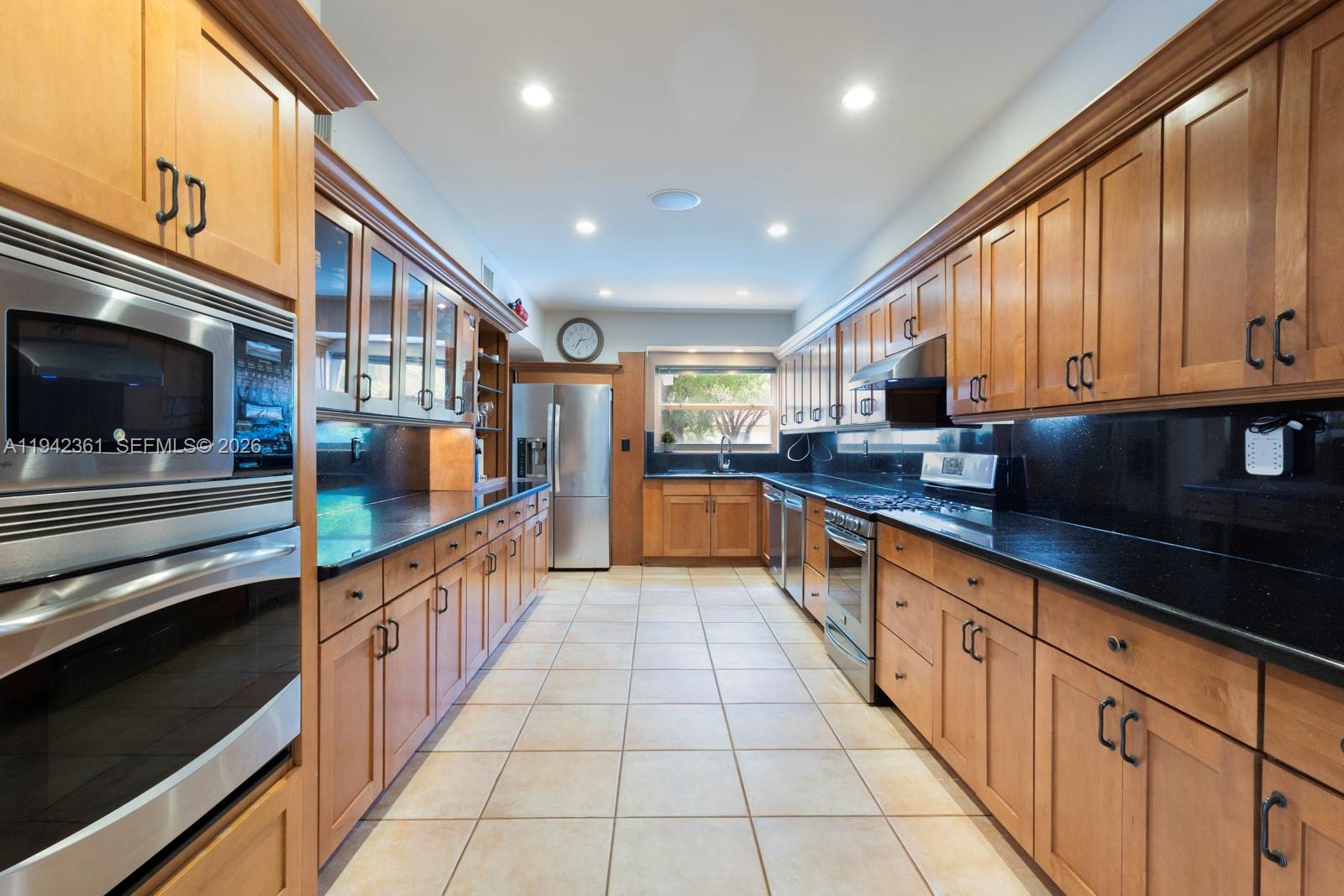 360 Southwest 28th Road Miami, FL 33129 - Photo 10 of 41 a large kitchen with stainless steel appliances lots of counter space and a sink