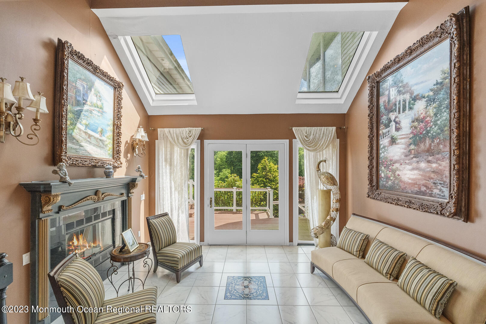 8 Applegate Terrace Manalapan, NJ 07726 - Photo 11 of 36 a living room with furniture and a floor to ceiling window