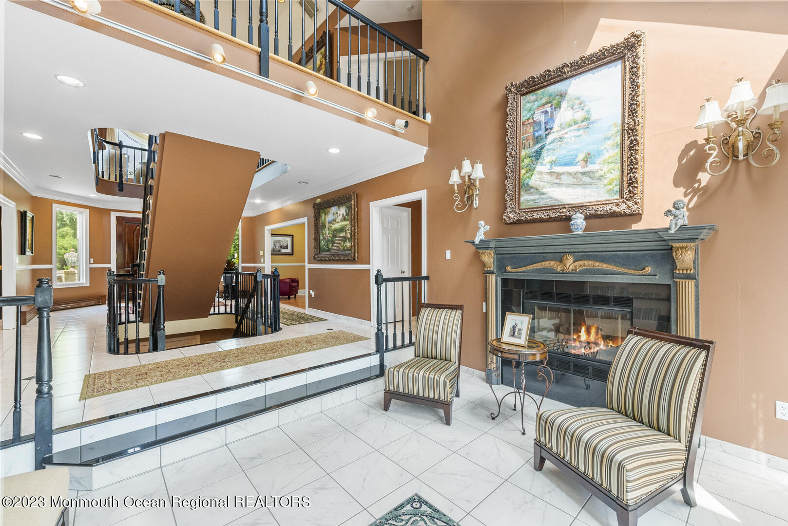 8 Applegate Terrace Manalapan, NJ 07726 - Photo 12 of 36 a living room with furniture a fireplace and a flat screen tv