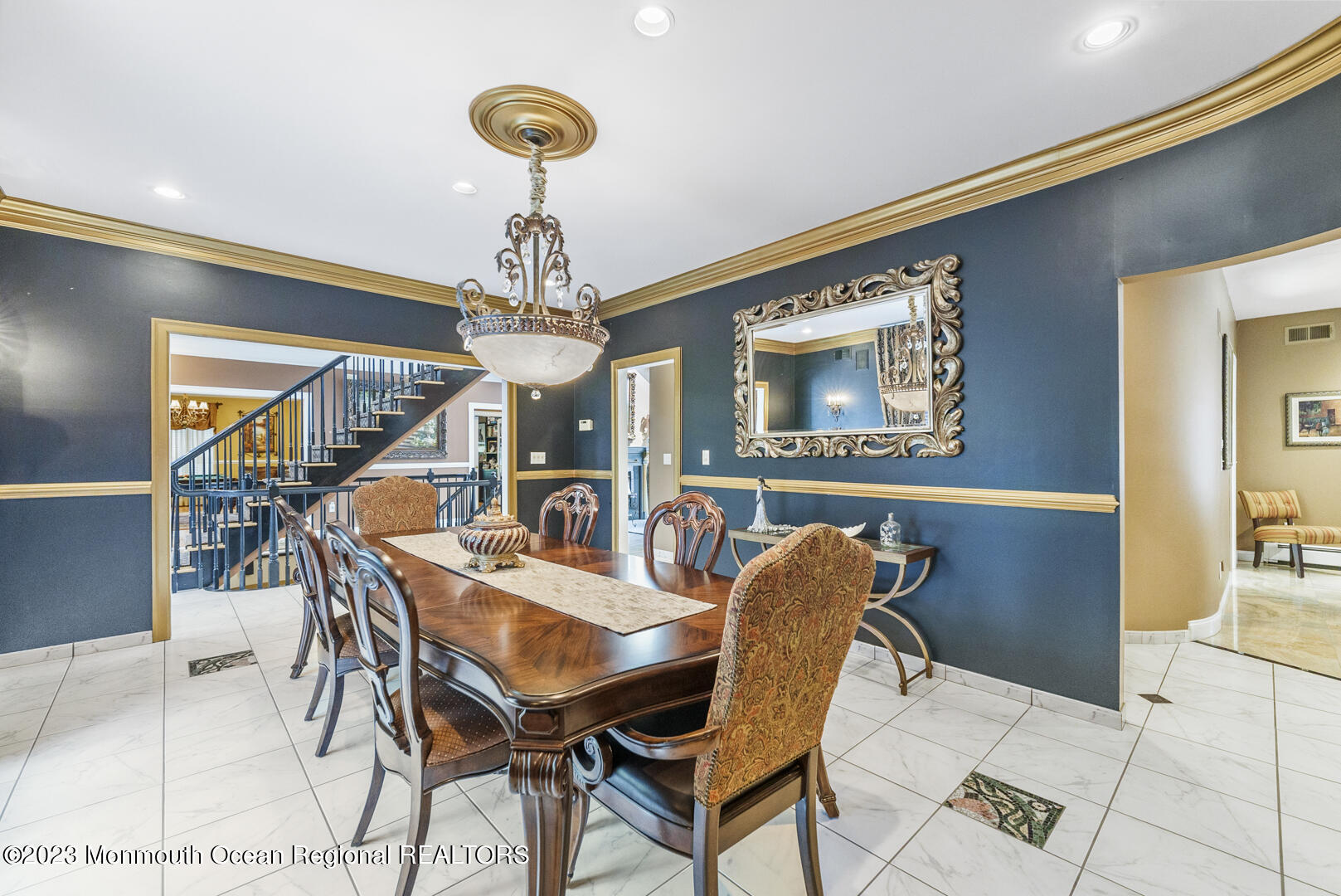 8 Applegate Terrace Manalapan, NJ 07726 - Photo 13 of 36 a view of a dining room with furniture and chandelier