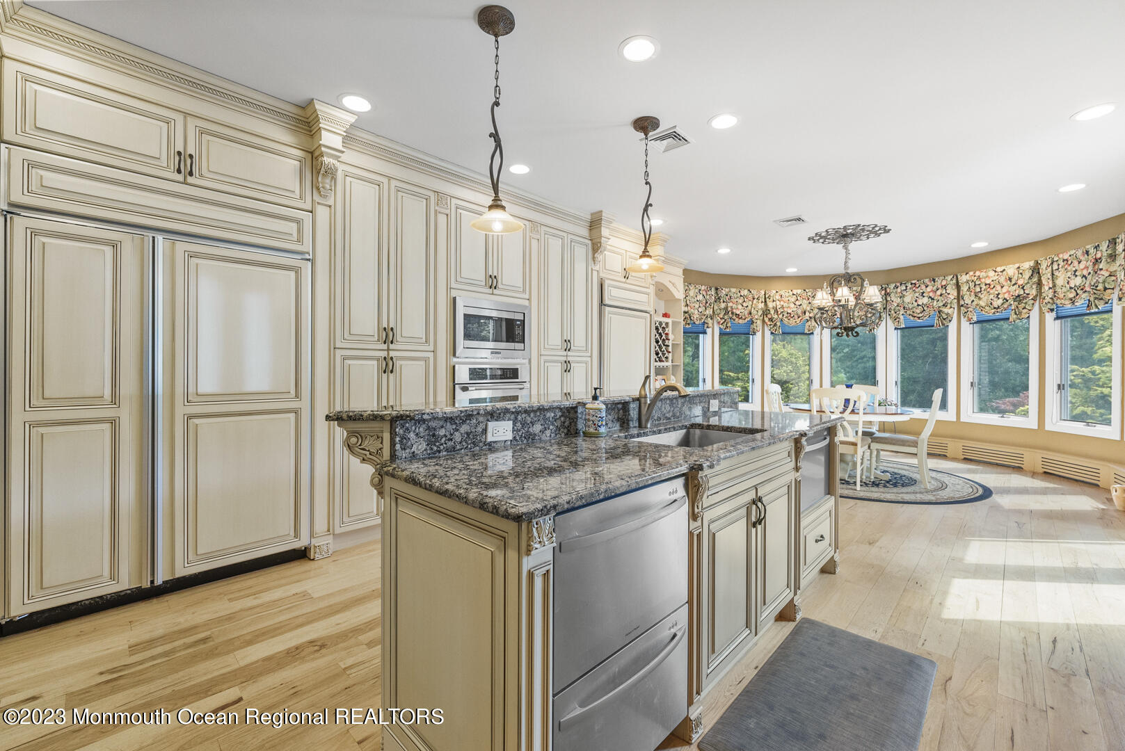 8 Applegate Terrace Manalapan, NJ 07726 - Photo 16 of 36 a kitchen with stainless steel appliances granite countertop a sink and a refrigerator
