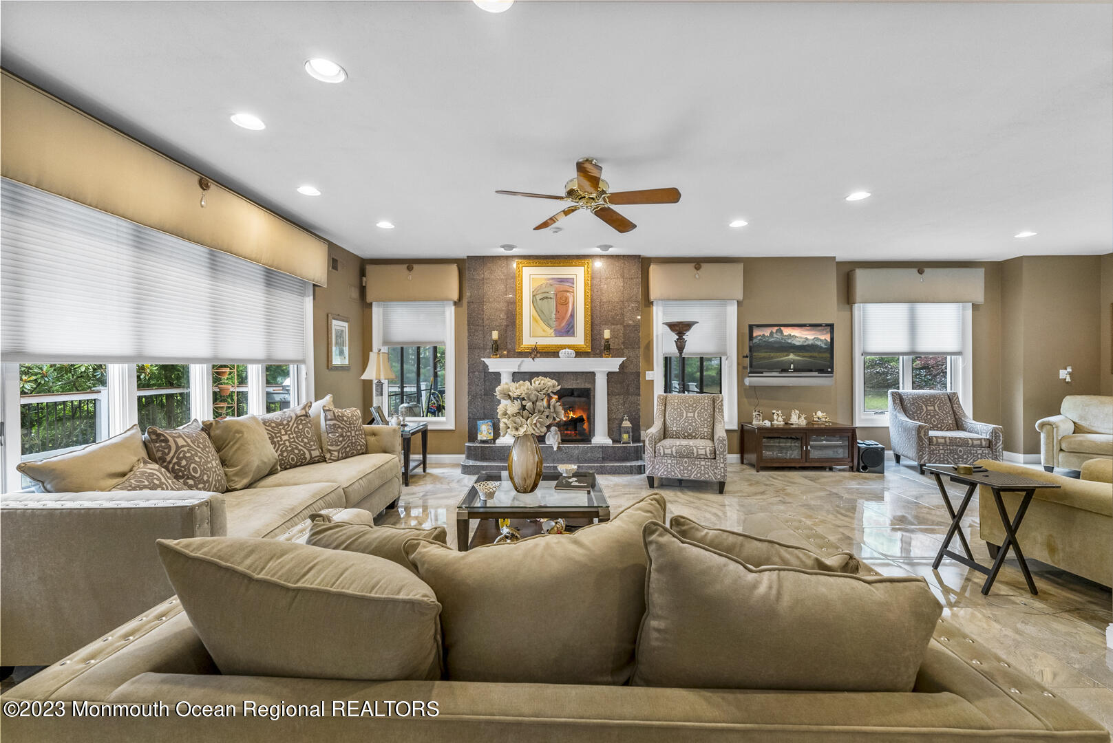 8 Applegate Terrace Manalapan, NJ 07726 - Photo 17 of 36 a living room with furniture ceiling fan and a large window