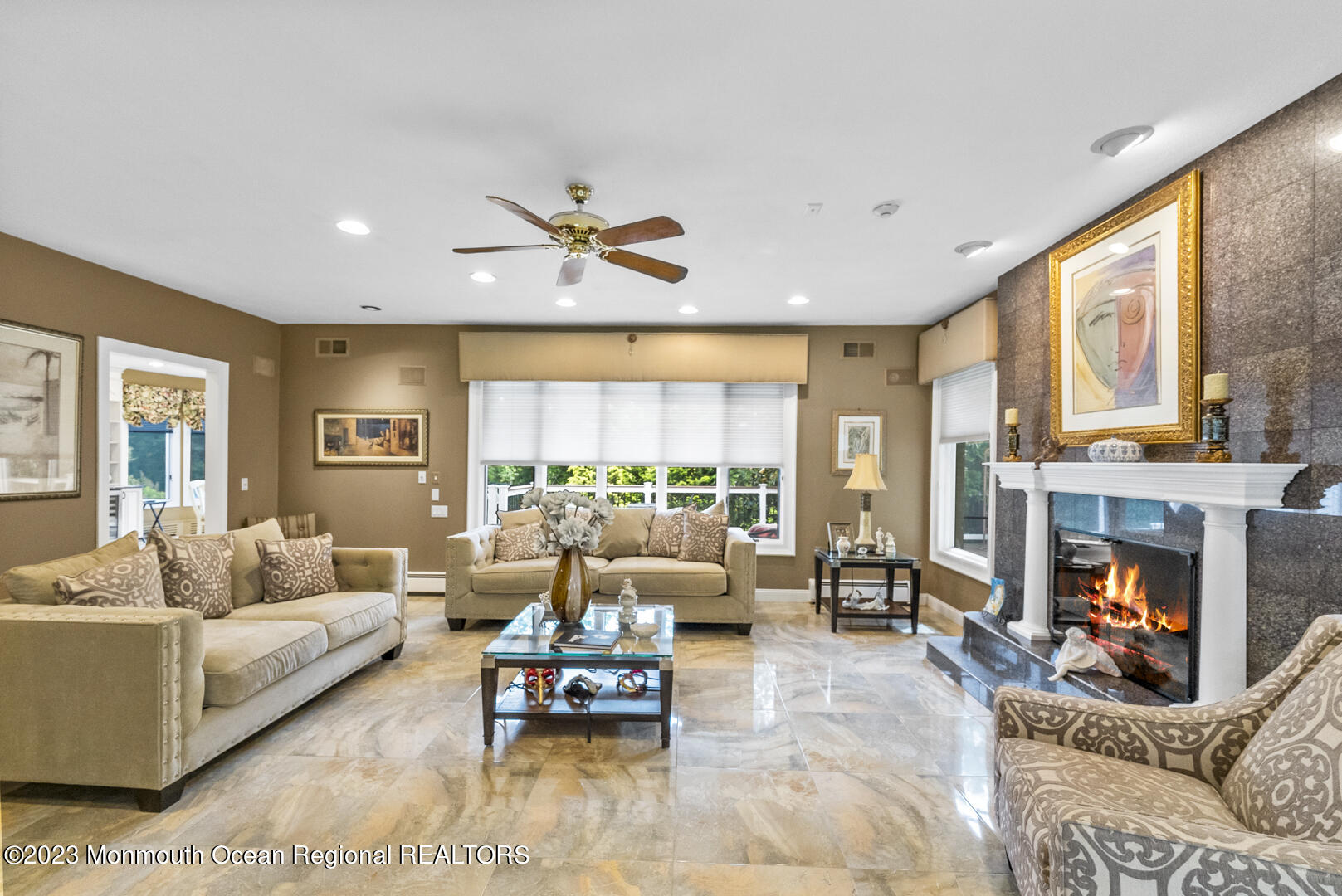 8 Applegate Terrace Manalapan, NJ 07726 - Photo 18 of 36 a living room with furniture fireplace and a large window