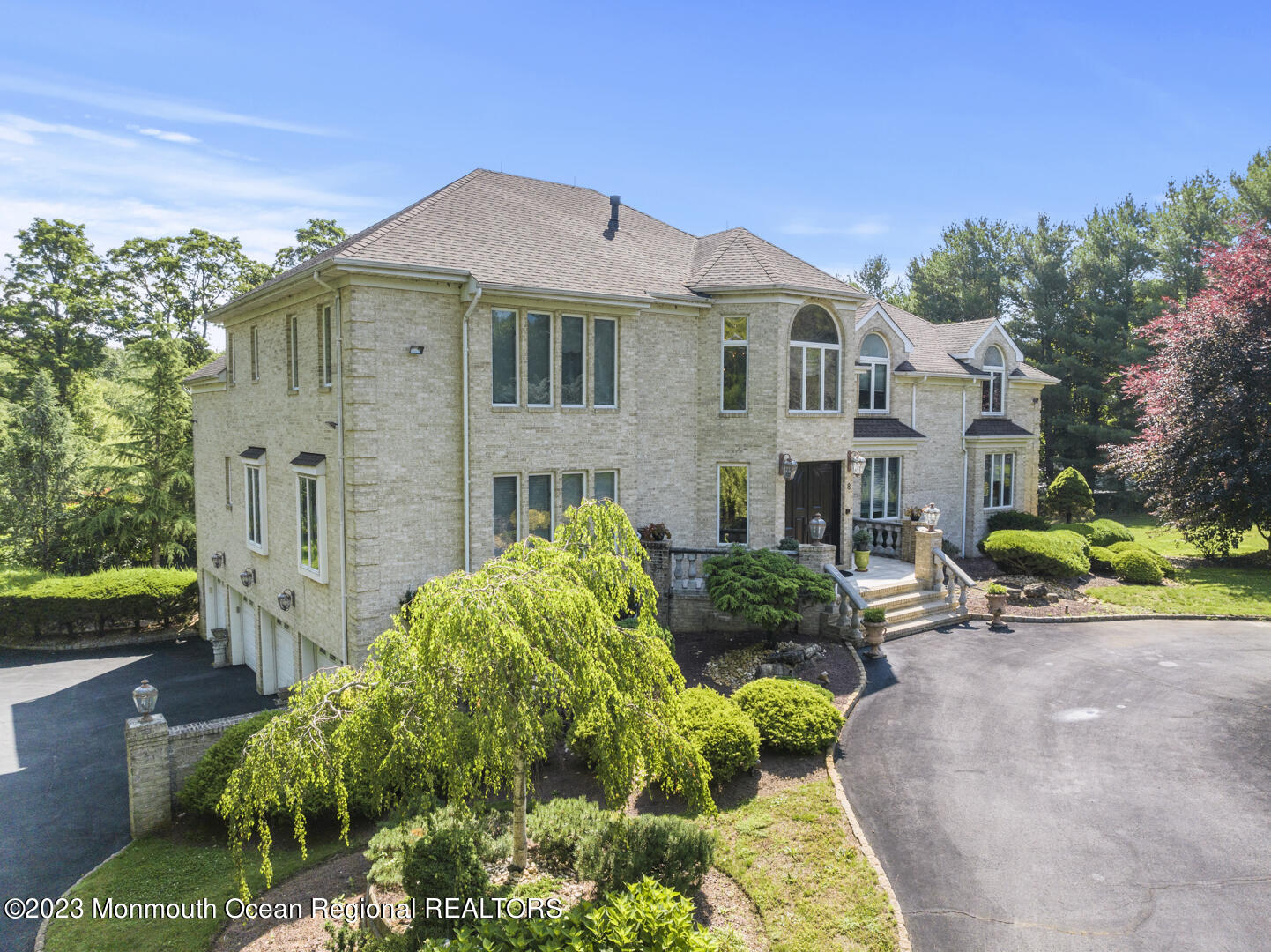 8 Applegate Terrace Manalapan, NJ 07726 - Photo 2 of 36 a front view of a house with garden