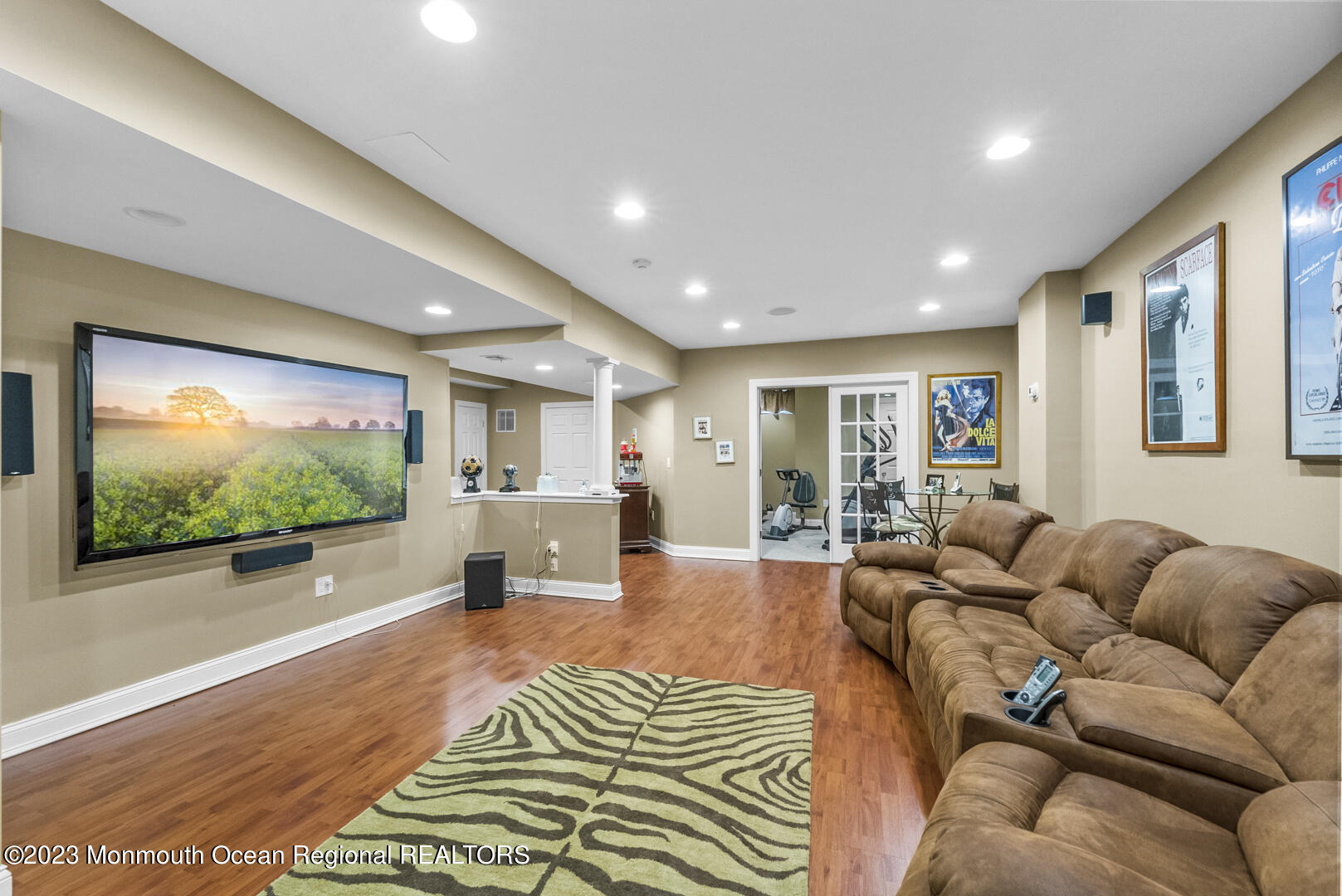 8 Applegate Terrace Manalapan, NJ 07726 - Photo 21 of 36 a living room with furniture and a flat screen tv