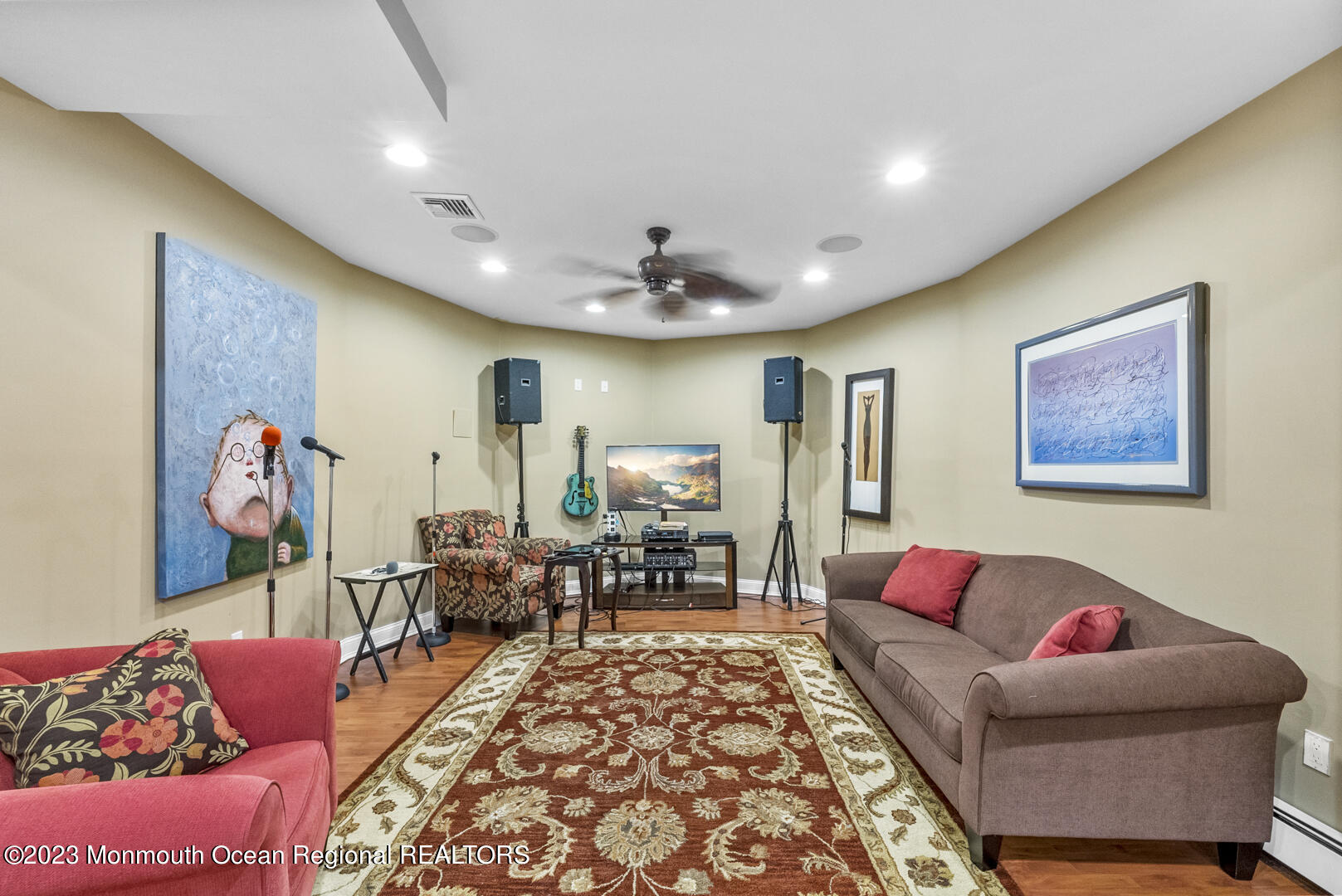 8 Applegate Terrace Manalapan, NJ 07726 - Photo 22 of 36 a living room with furniture and a flat screen tv