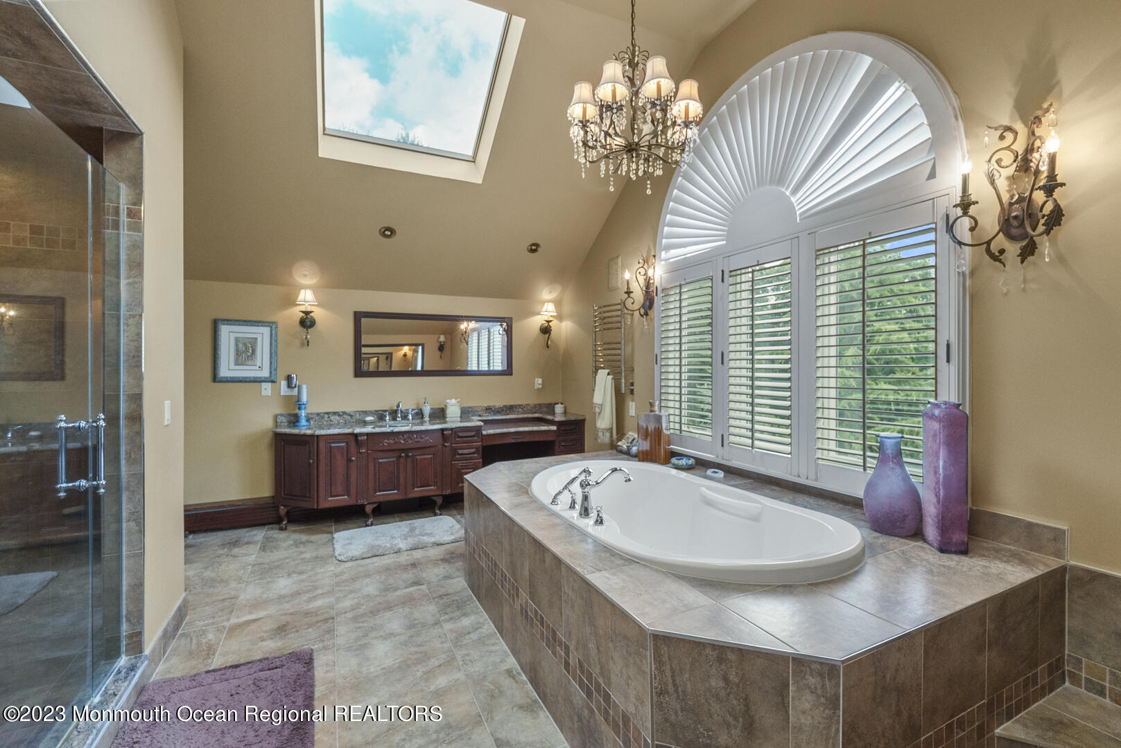 8 Applegate Terrace Manalapan, NJ 07726 - Photo 25 of 36 a bathroom with a tub sink and mirror