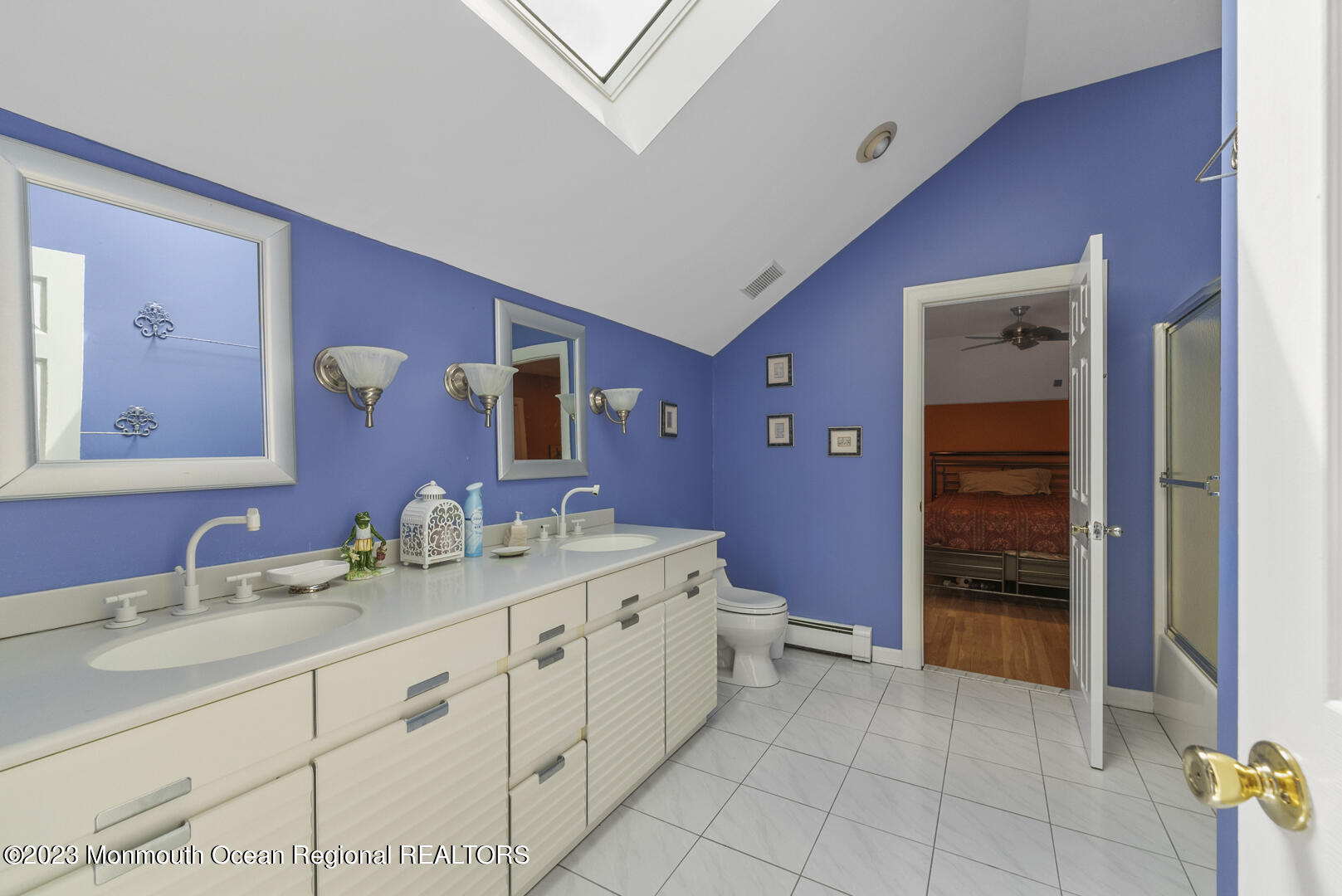 8 Applegate Terrace Manalapan, NJ 07726 - Photo 28 of 36 a spacious bathroom with a double vanity sink a mirror and a bathtub