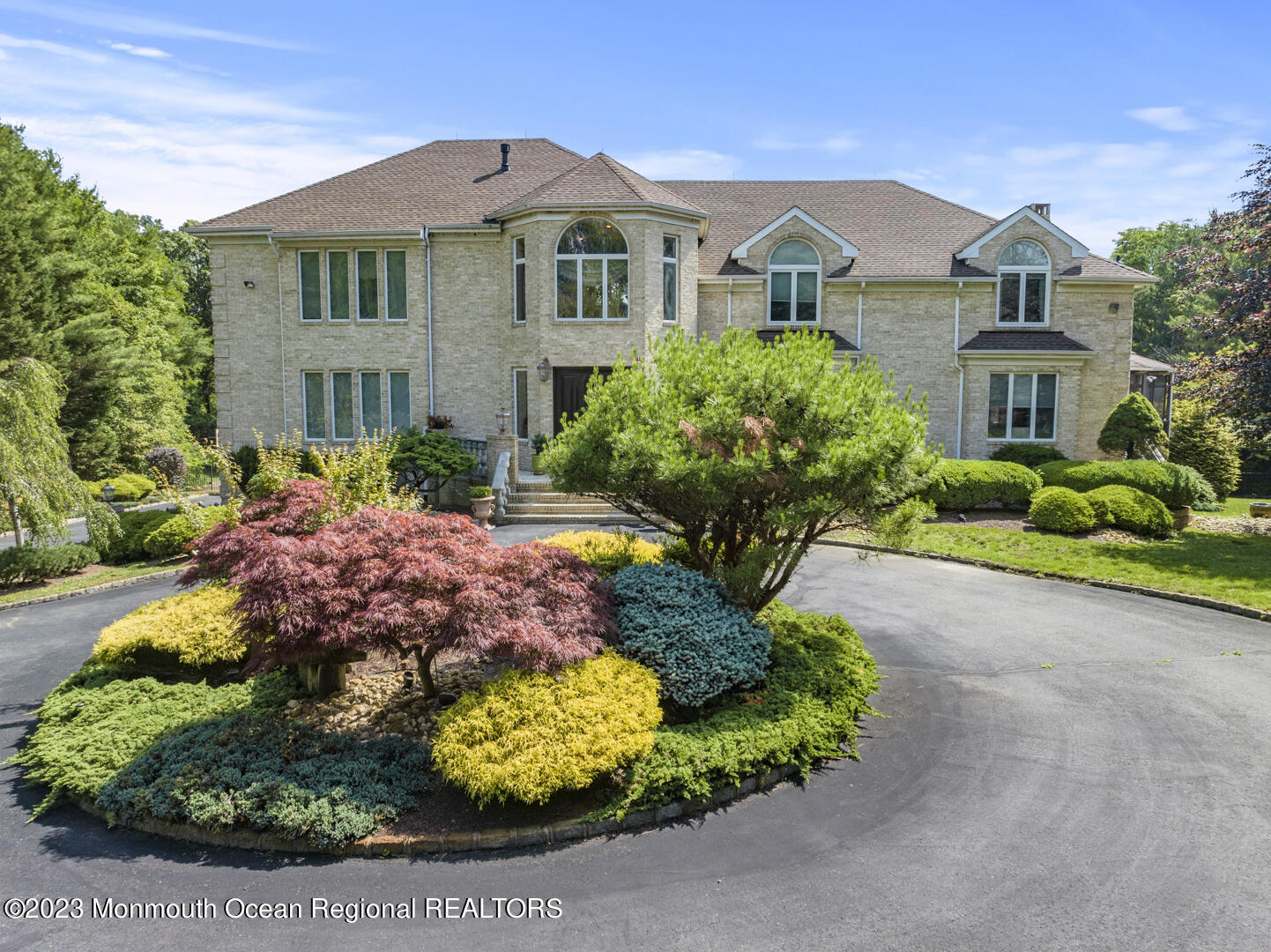 8 Applegate Terrace Manalapan, NJ 07726 - Photo 3 of 36 a front view of a house with a yard and potted plants