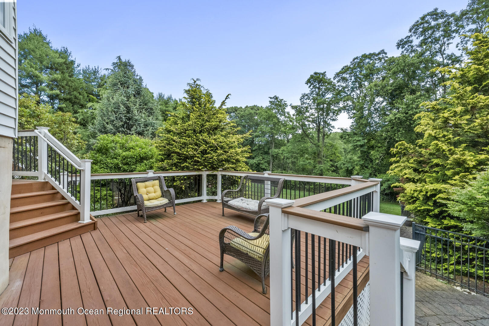 8 Applegate Terrace Manalapan, NJ 07726 - Photo 33 of 36 a view of balcony with deck and wooden floor