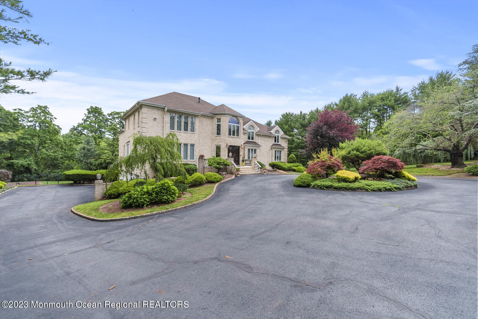 8 Applegate Terrace Manalapan, NJ 07726 - Photo 36 of 36 a front view of a house with a yard