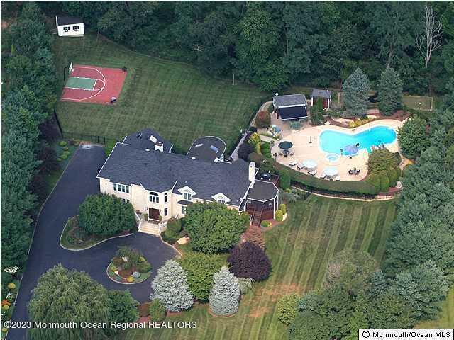 8 Applegate Terrace Manalapan, NJ 07726 - Photo 4 of 36 an aerial view of a house with outdoor space and lake view