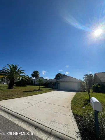 a view of a lake with houses in the back