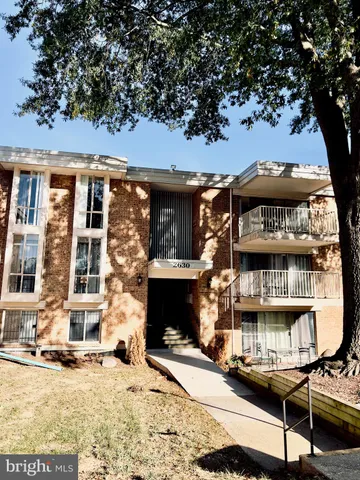 a front view of a building with street view
