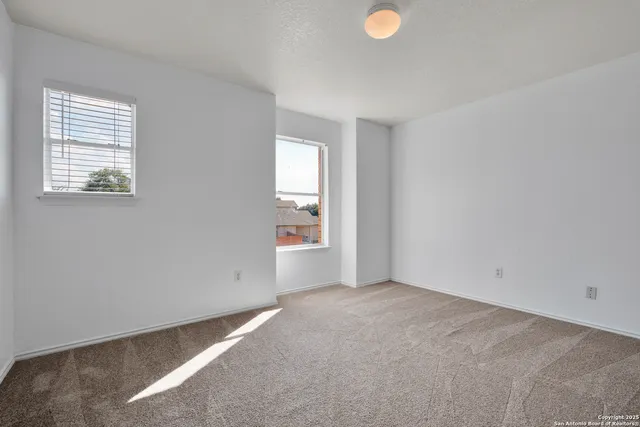 an empty room with windows