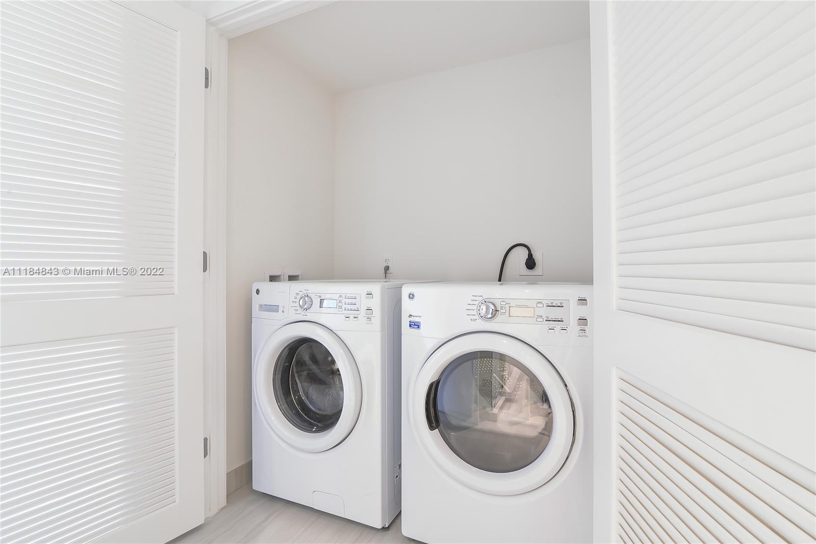 4010 South Ocean Drive, Unit R1405 Hollywood, FL 33019 - Photo 17 of 67 a utility room with dryer and washer