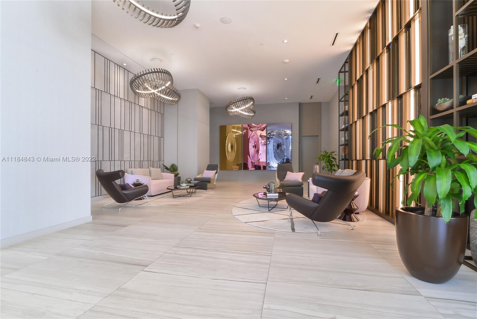 4010 South Ocean Drive, Unit R1405 Hollywood, FL 33019 - Photo 25 of 67 a living room with furniture flowerpot and wooden floor